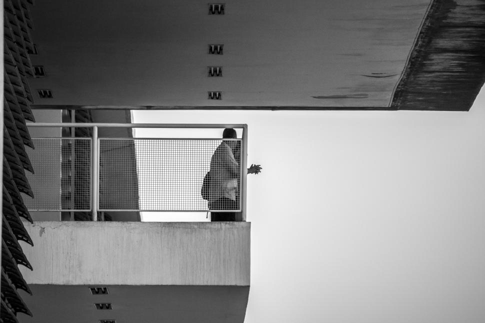 Free Image of Man Skating Up Side of Tall Building 
