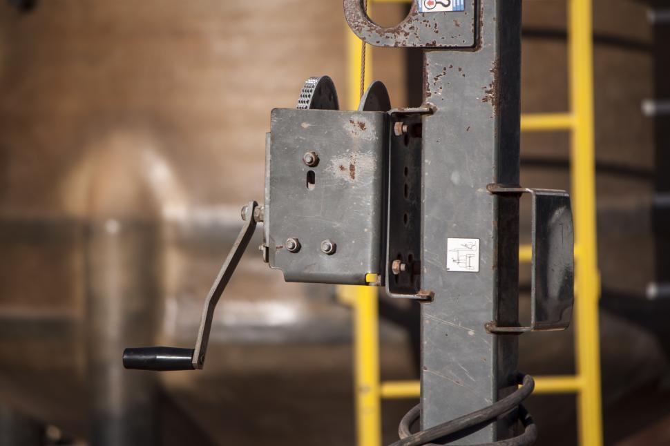 Free Image of Close Up of a Machine With a Yellow Handle 