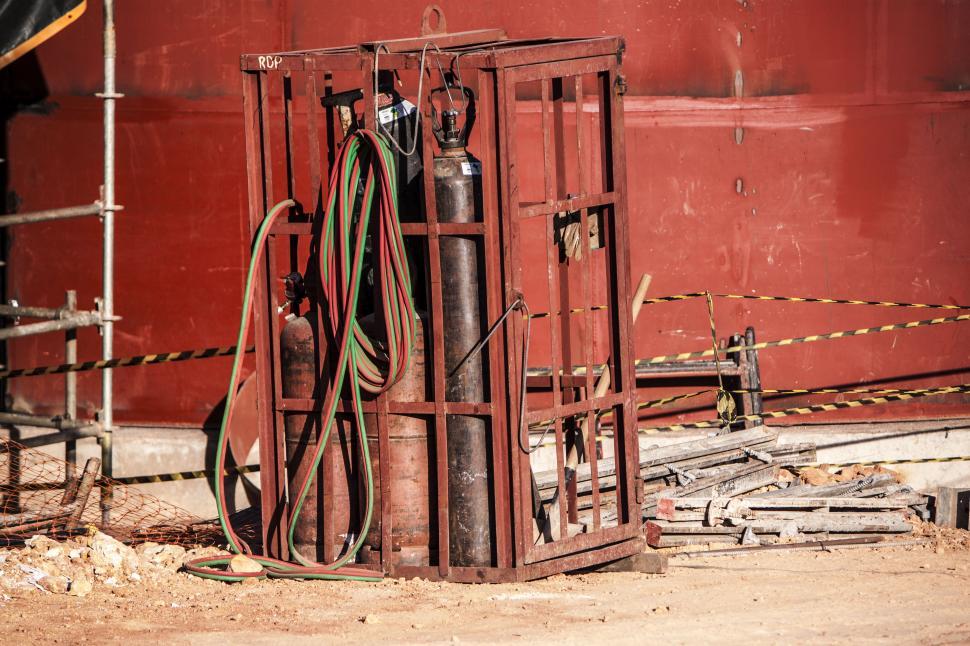 Free Image of Large Red Building With Wires 
