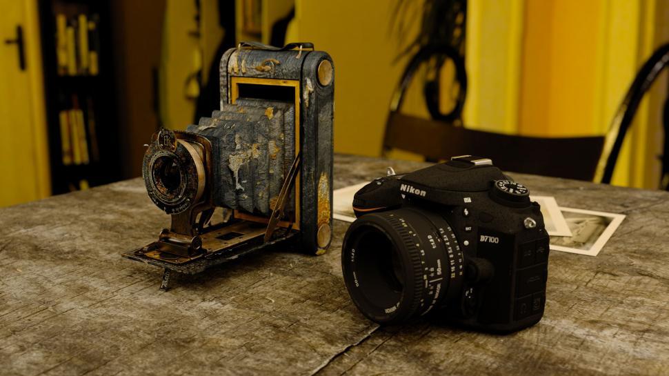 Free Image of Antique Camera and New Nikon Camera 