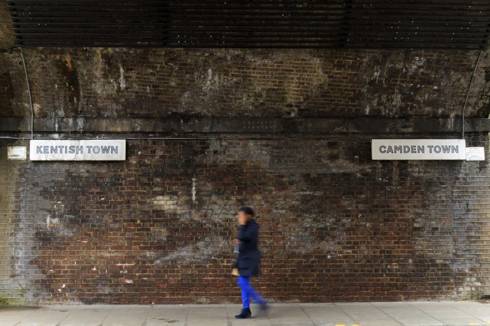 Free Image of Unidentified individual walks between Camden and Kentish tow Lon 
