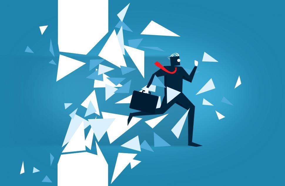 Free Image of Businessman Blasting Through a Wall - Overcoming Barriers 