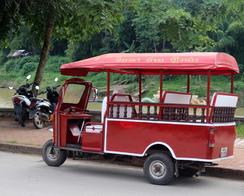 Free Image of Red Tuk Tuk parked  
