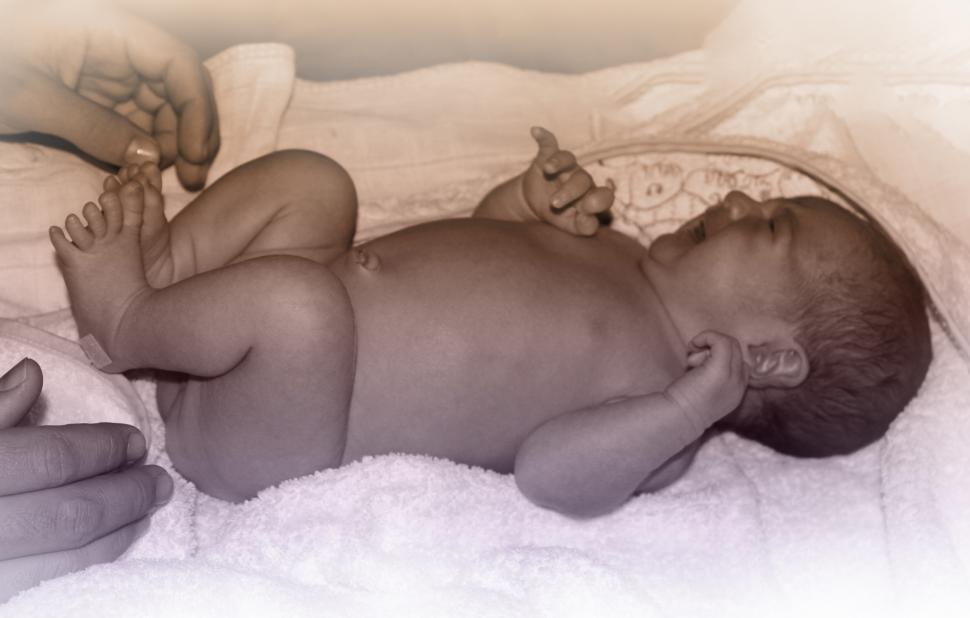 Free Image of Newborn Baby Crying While Changing Diapers 