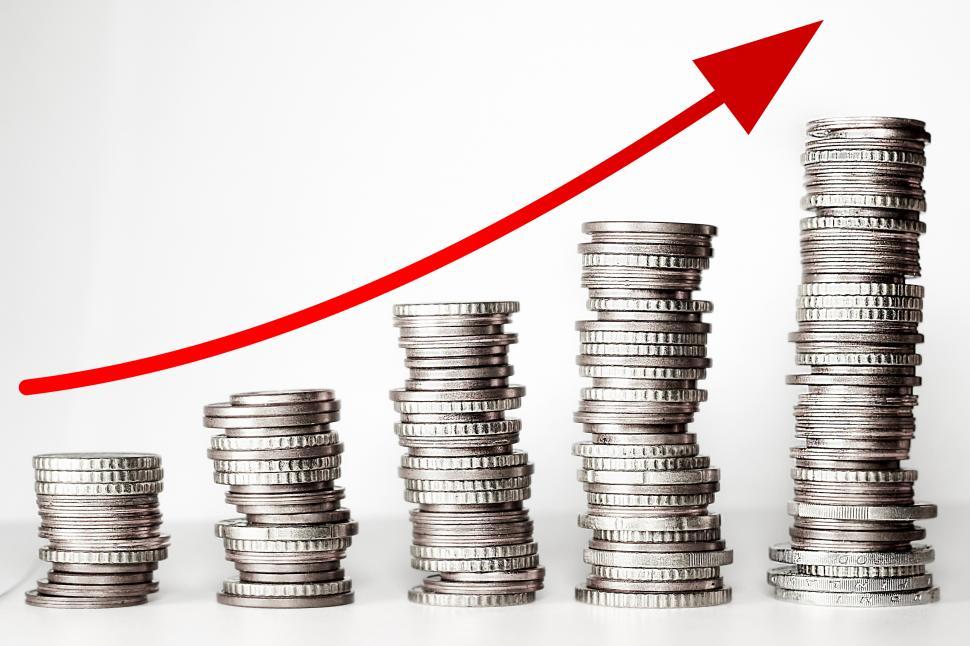 Free Image of Capital Appreciation - Arrow Trending Up Over Coins 