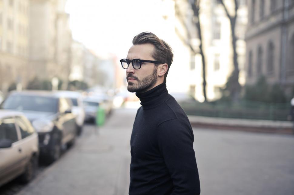 Free Image of Young Adult Man in black turtleneck top posing at the street 