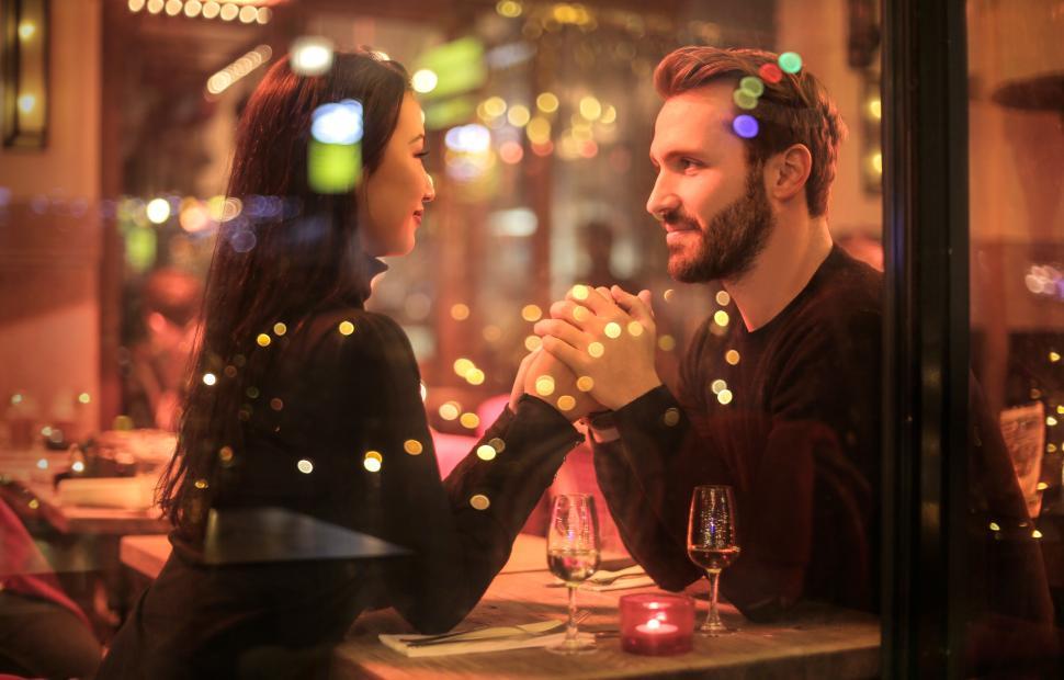 Free Image of Young Adult Couple Holding Hands 