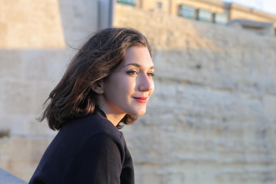 Free Image of Young Woman In Black Coat and Red Lipstick 