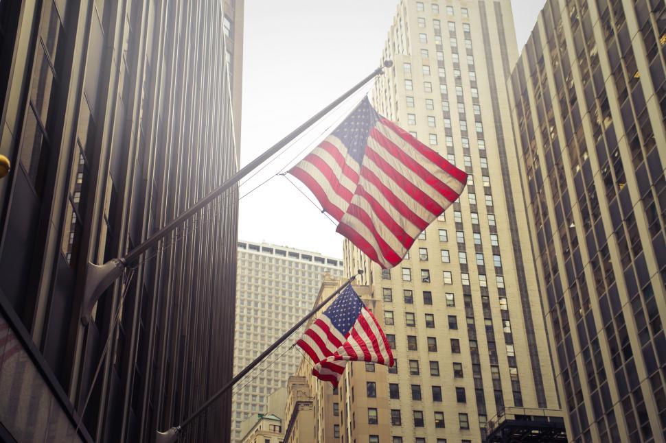 Free Image of Two Flags of USA Under White Clouds at Daytime 