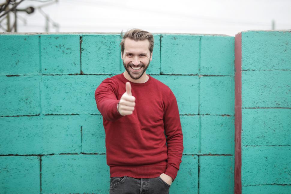 Free Image of Young Adult Man showing thumbs up gesture 