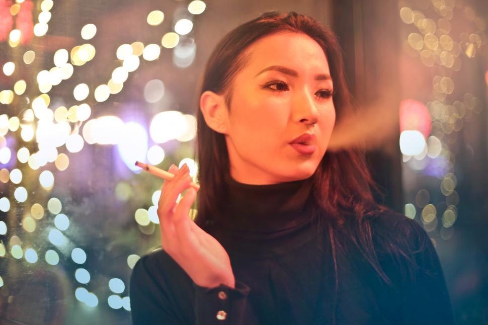 Free Image of Young Woman Smoking a Cigarette 