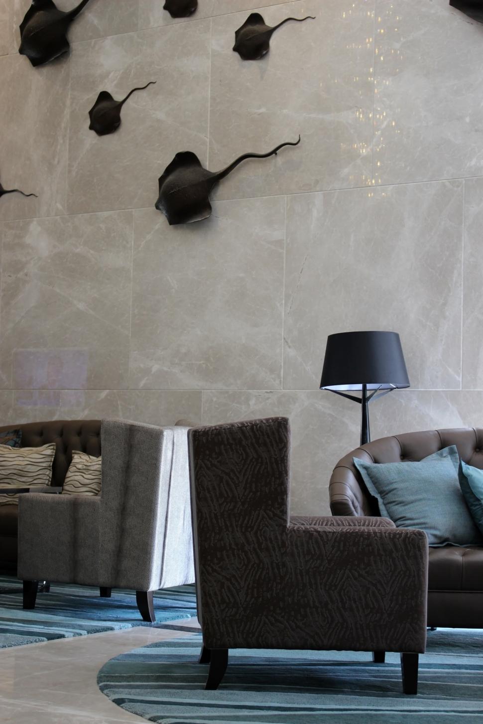 Free Image of Sofa and Chairs in an Empty Modern Marble Hotel Lobby  