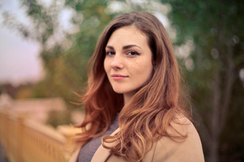 Free Image of Portrait Of Brown Haired Young Woman In Camel Jacket 