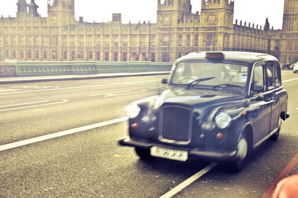 Free Image of Blue Taxi cab in motion, London 