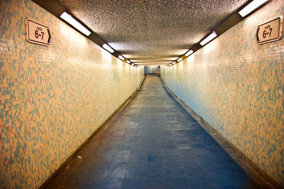 Free Image of Illuminated Empty Underground Walkway 