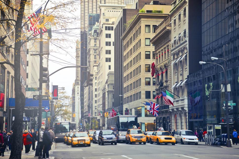 Free Image of Yellow taxis also known as yellow cabs stop at the red light dur 