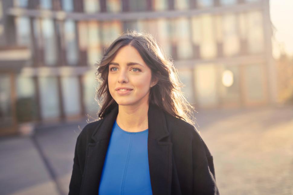 Free Image of Woman In Black Blazer And Blue Shirt Walking On Street 