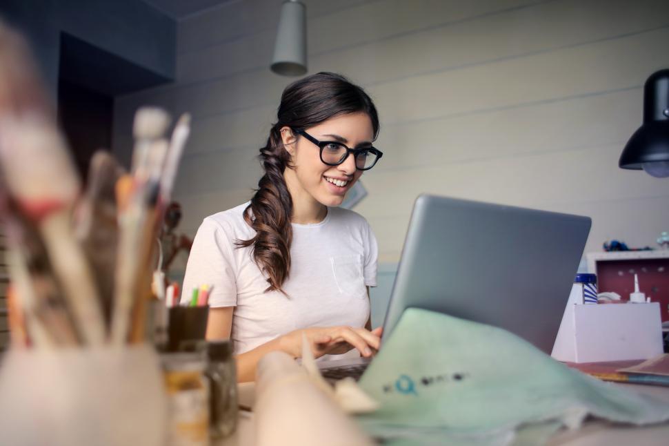 Free Image of A young woman working on her laptop 