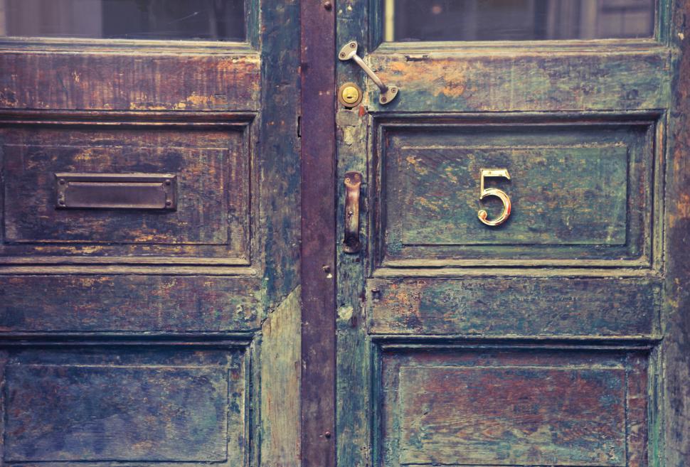 Free Image of Old wooden entrance doors with metal door number sign and mail h 