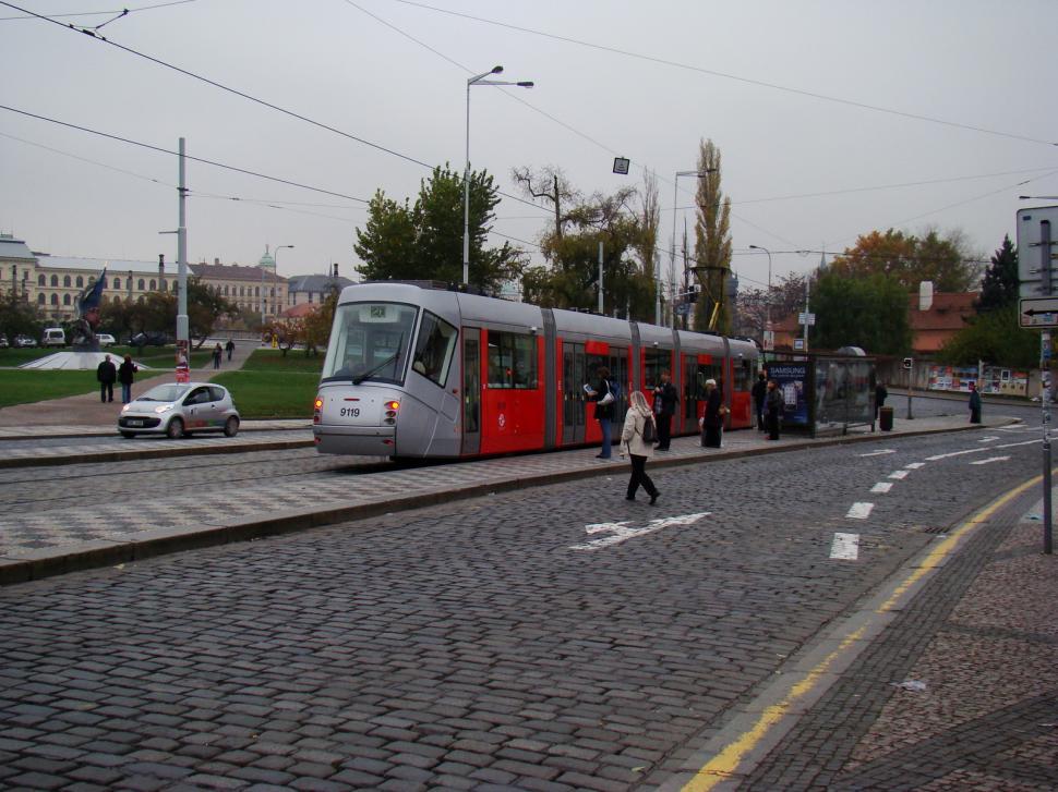 Free Image of Red and Silver Train Traveling Down Train Tracks 