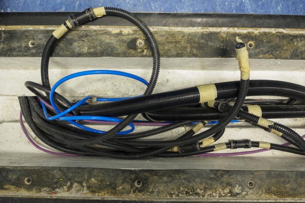 Free Image of Installing tubing in the floor 