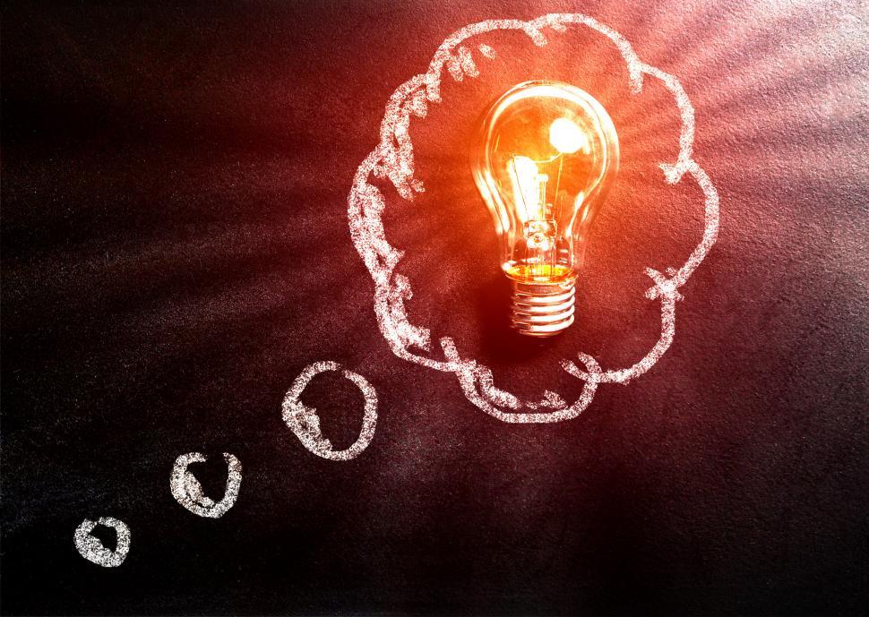 Free Image of Thought Concept with Light Bulb Over Blackboard 