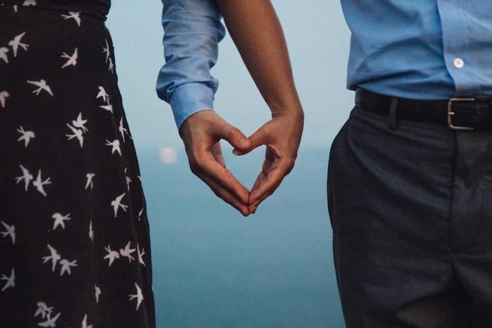 Free Image of Heart shape created by couple s hands 