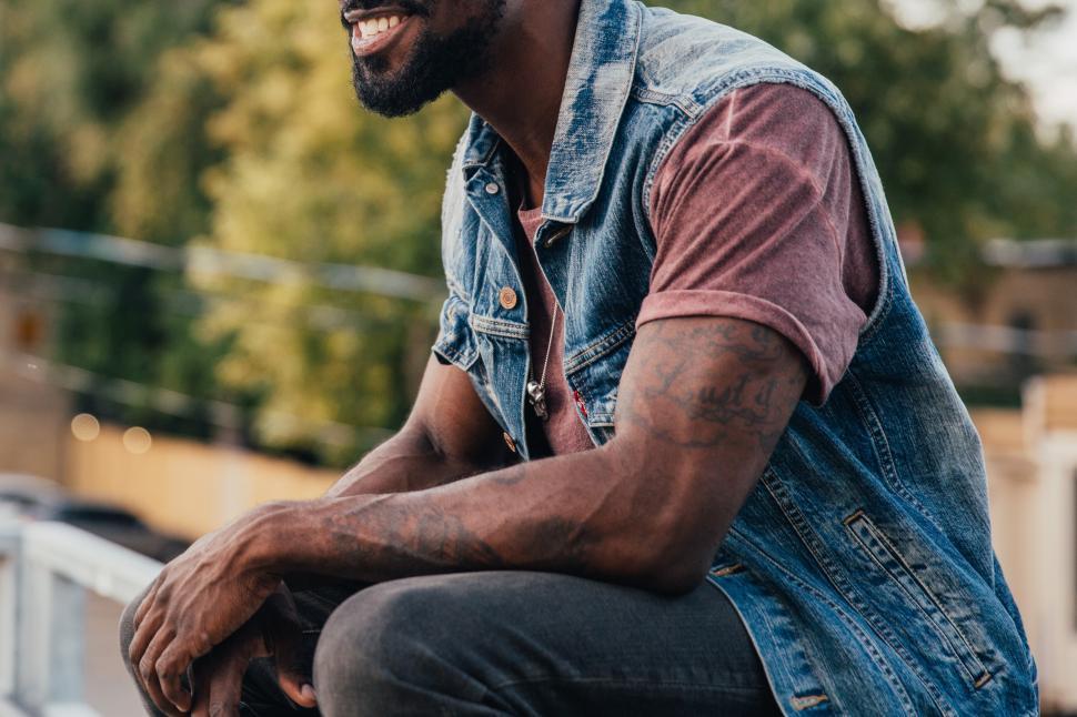 Free Image of A young man relaxing with smile 