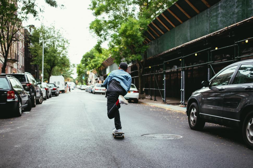 Free Image of A young caucasian skateboarder in the street 