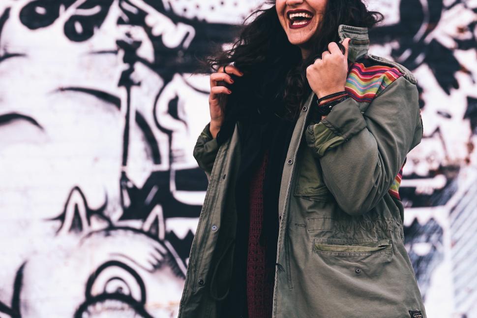 Free Image of A young black haired fashionable woman smiling 