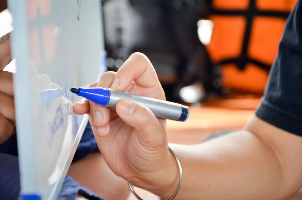 Free Image of Hand Writing on Whiteboard 
