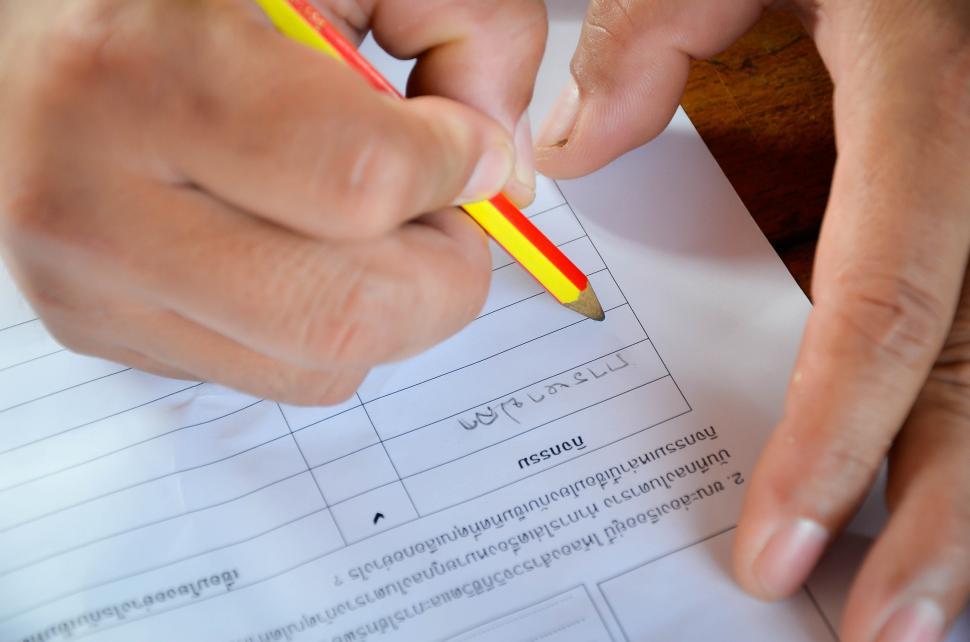 Free Image of Hand Writing - FIlling out Form 