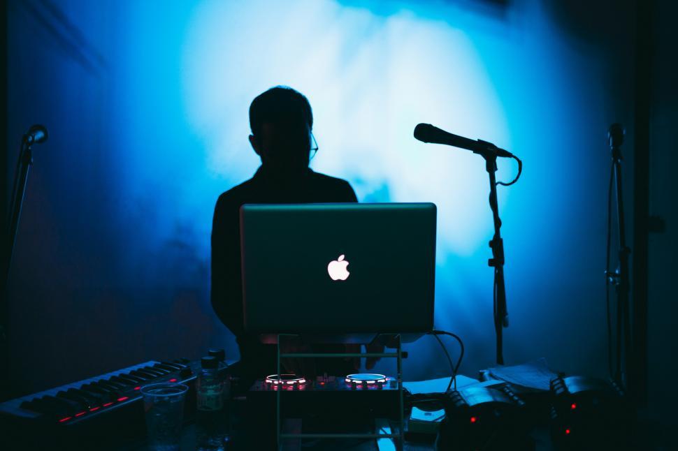 Free Image of A DJ in blue light 