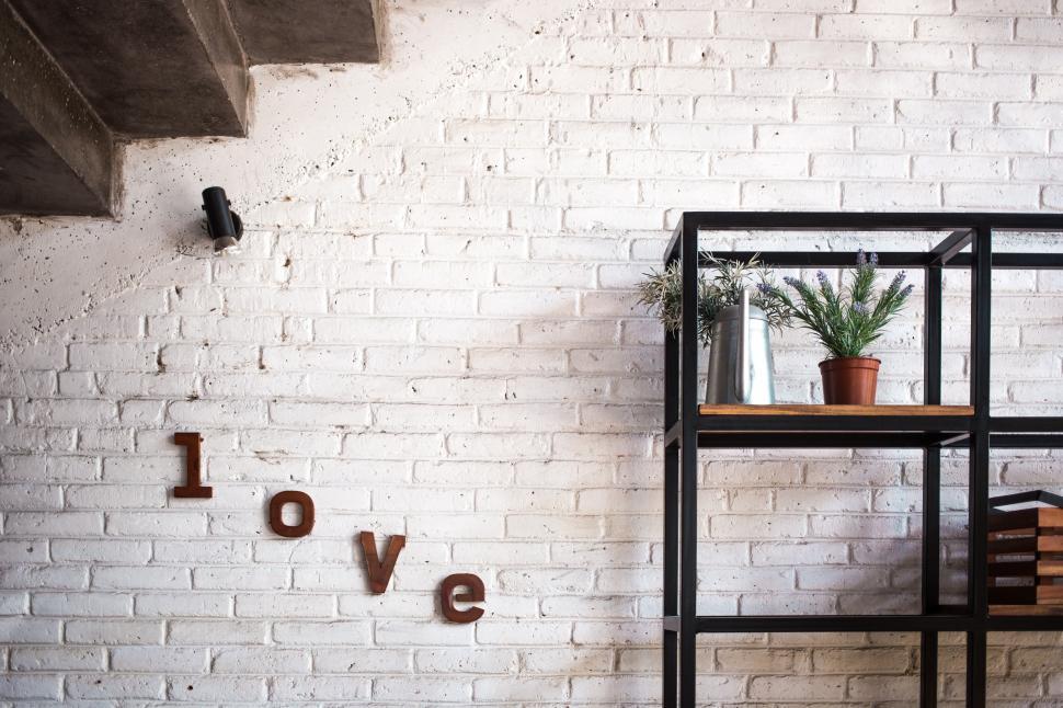 Free Image of A decorated brick wall in the living room 