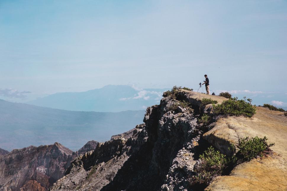 Free Image of A photographer picturing mountain ridge 