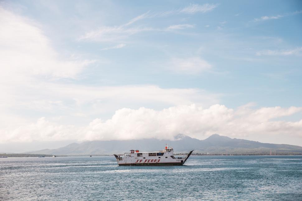 Free Image of White ferry in clear blue water 