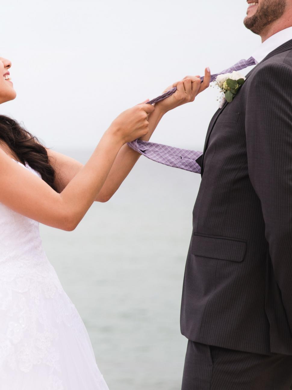 Free Image of Bride and groom play at weeding 