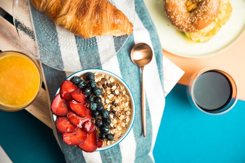 Free Image of Strawberries and granola on a breakfast table 