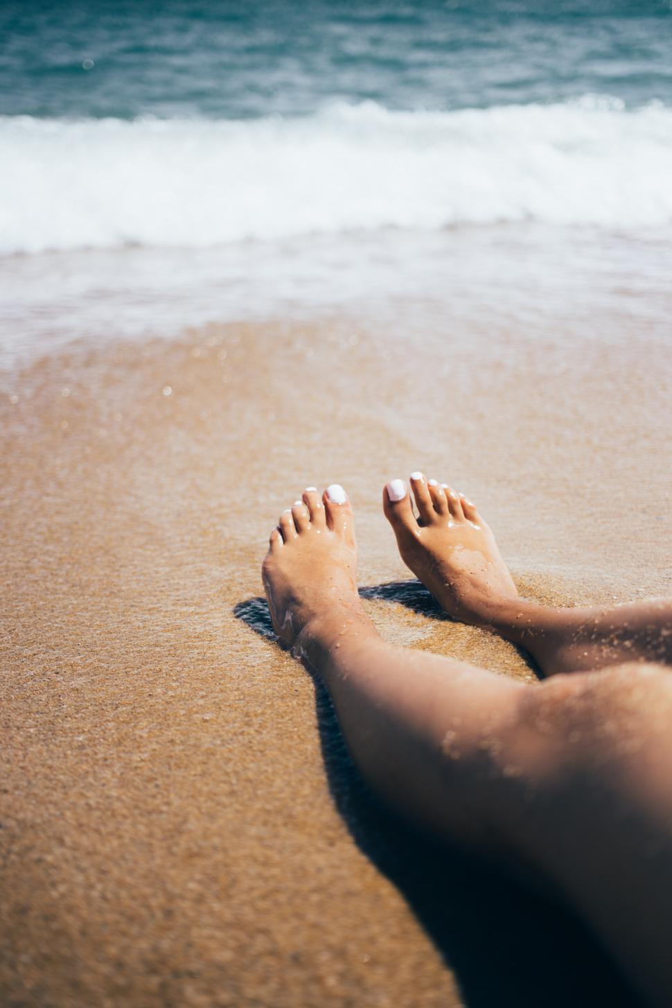Free Image of Sandy feet on the beach 