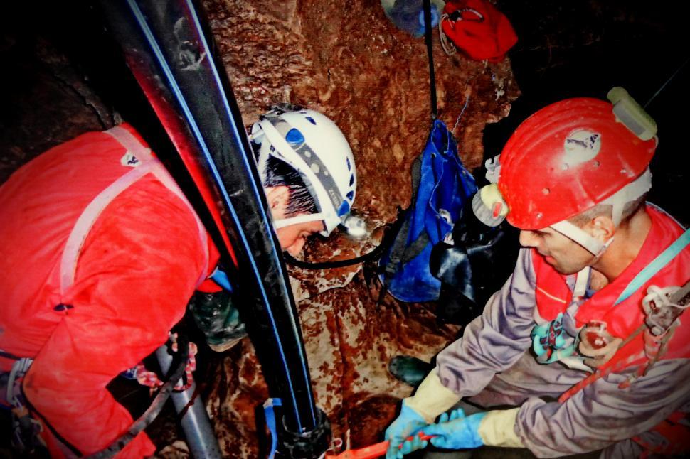 Free Image of Speleology - Cave Explorers Working Inside a Cave - Scientists 