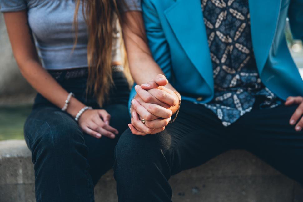 Free Image of A young caucasian couple sitting together 