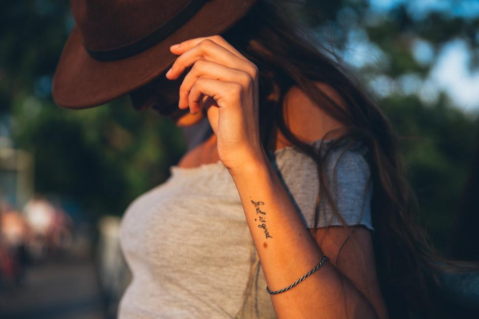 Free Image of A young Caucasian woman posing at sunset 
