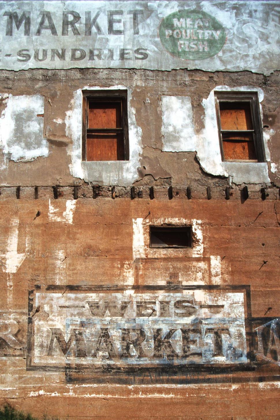 Free Image of Vintage Market Signs on Building 