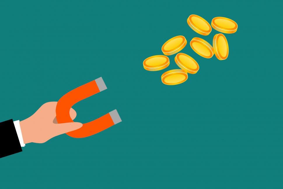 Free Image of using magnet  to attract coins   