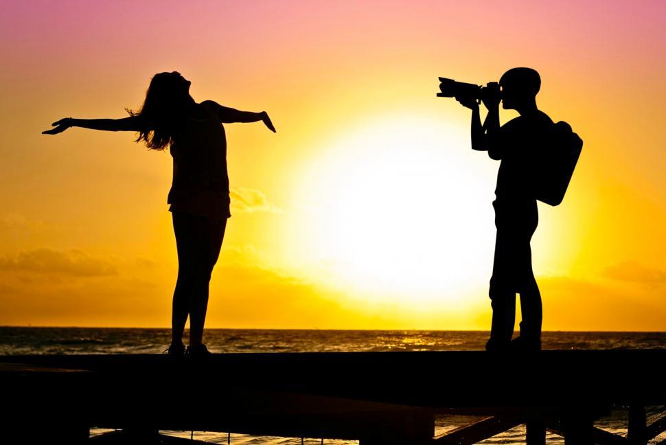 Free Image of man taking pictures of Girl  