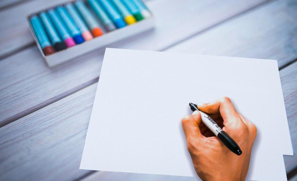 Free Image of hand holding pen and writing  