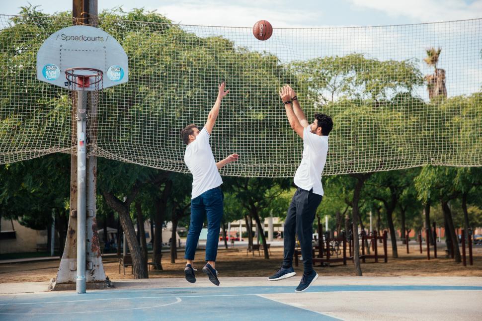 Free Image of Two young men playing basketball 