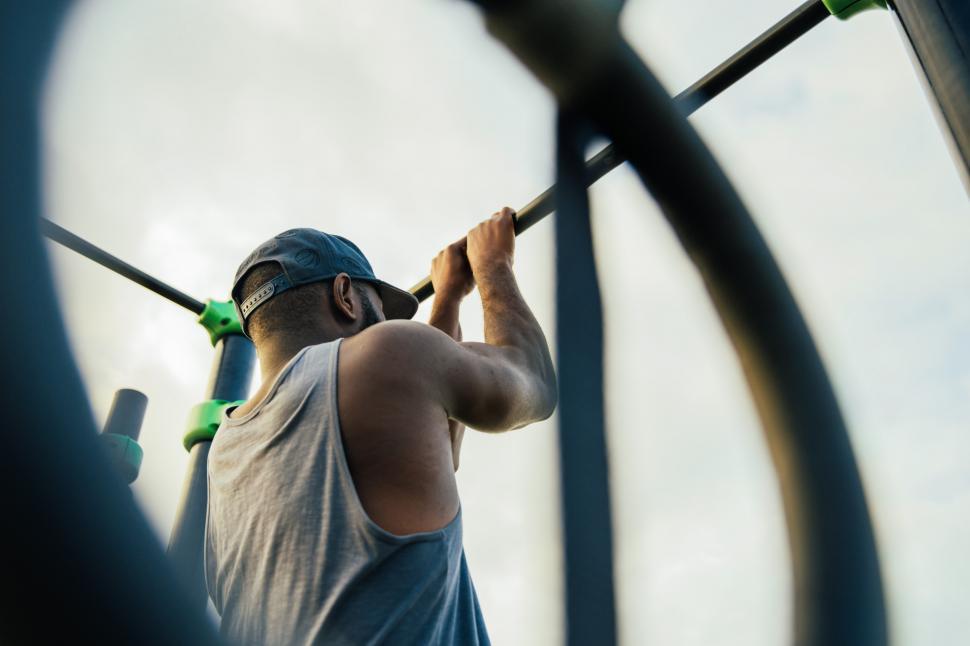 Free Image of A young african man doing chin-up exercise 