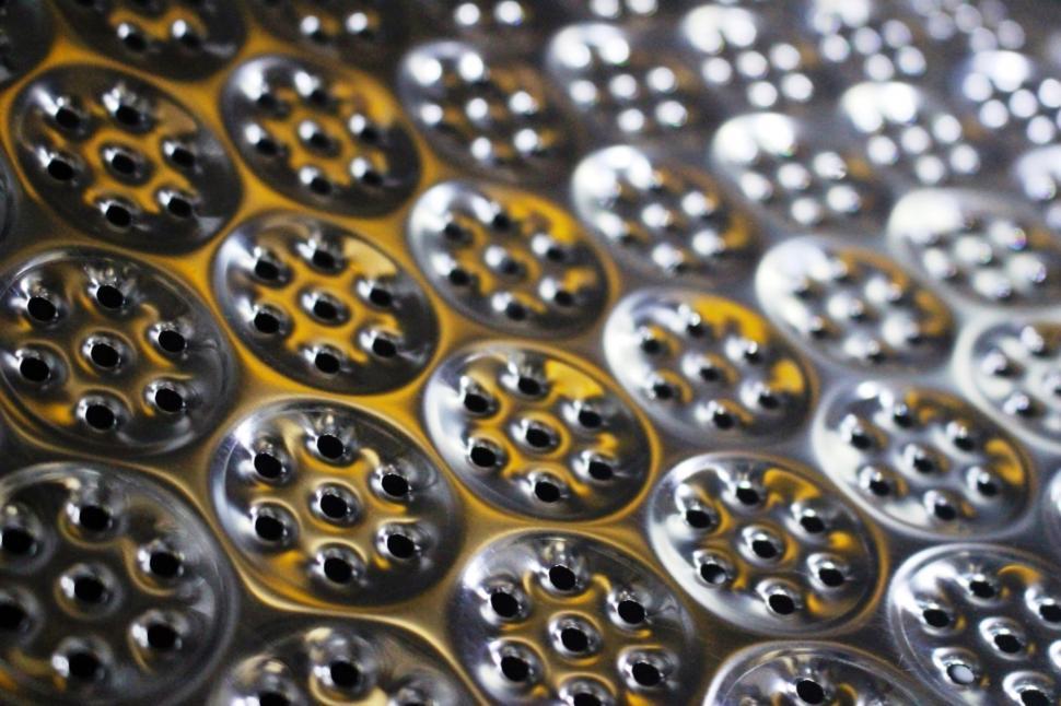 Free Image of Abstract futuristic background of metallic cogs and wheel shapes in light and shadow  