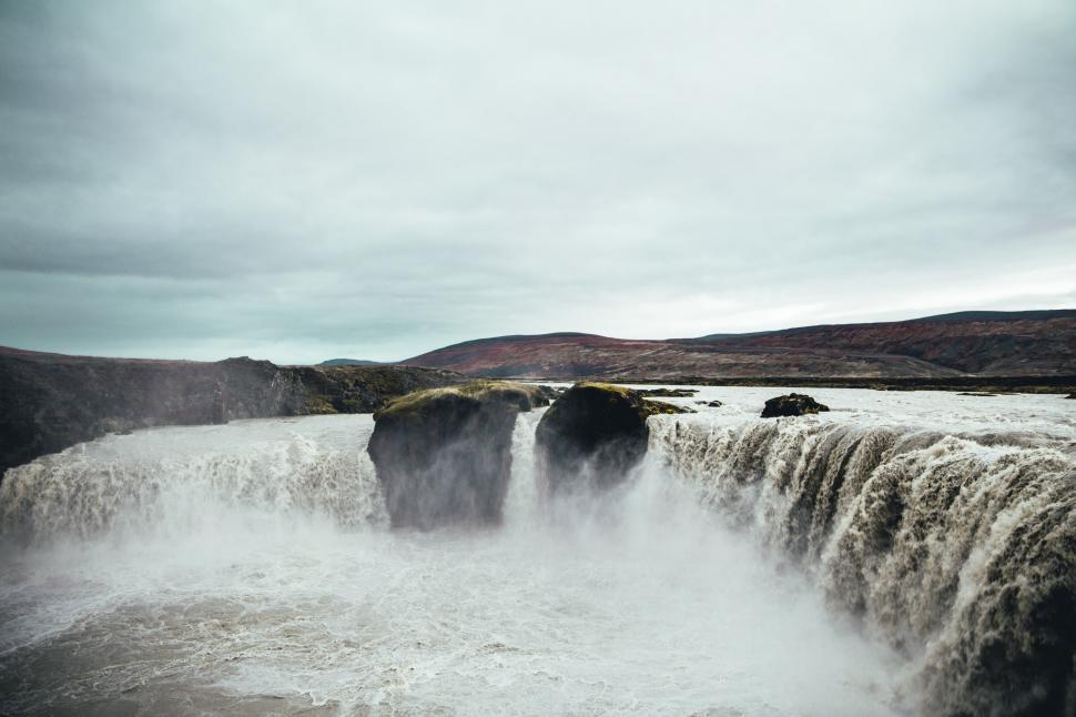 Free Image of Rapids forming waterfall in the mountains 